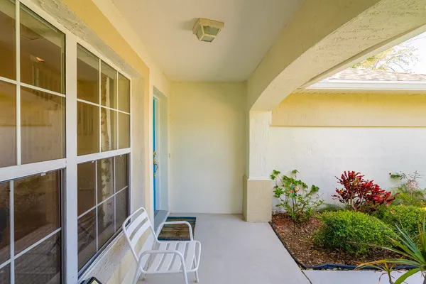 a view of a hallway with wooden shelves
