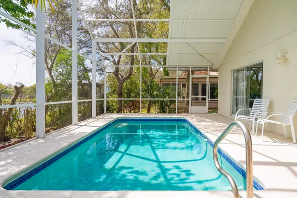 a bathroom with a sink a toilet and a shower curtain