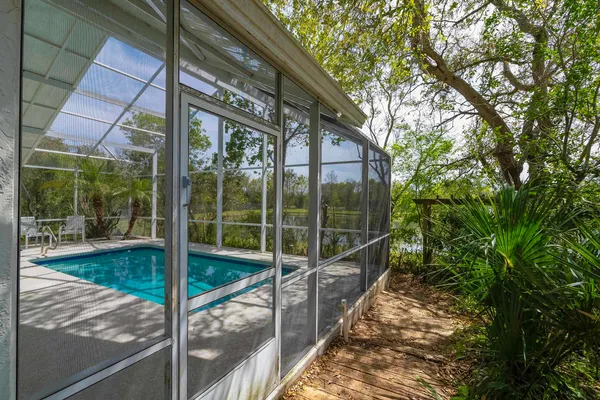 a view of a swimming pool with a patio