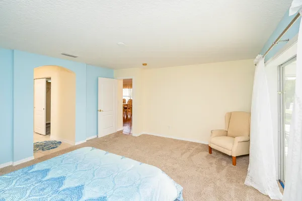 a view of a chair and table in a patio