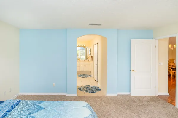 a living room with furniture and a large window with outer view