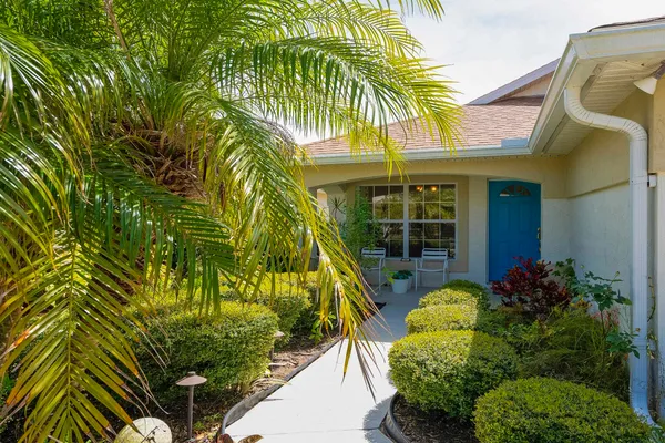 an aerial view of residential houses with outdoor space and swimming pool