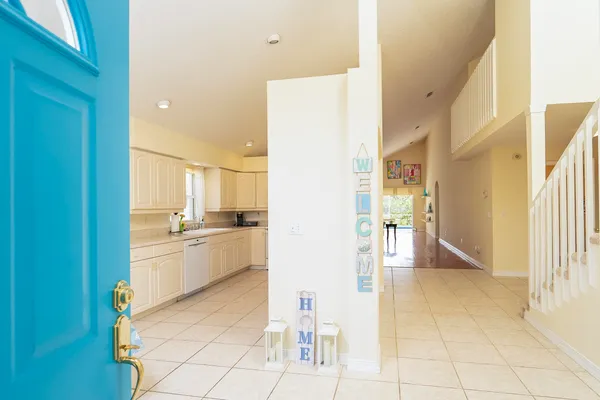 a kitchen with a sink a counter top space stainless steel appliances and cabinets