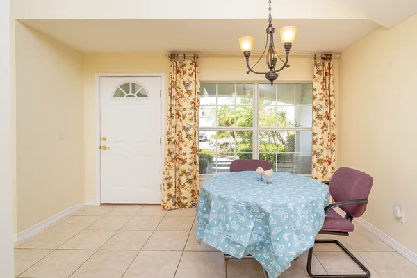 a view of a house with a backyard and a patio