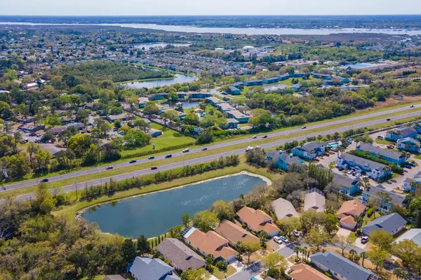 a bedroom with a bed and glass door