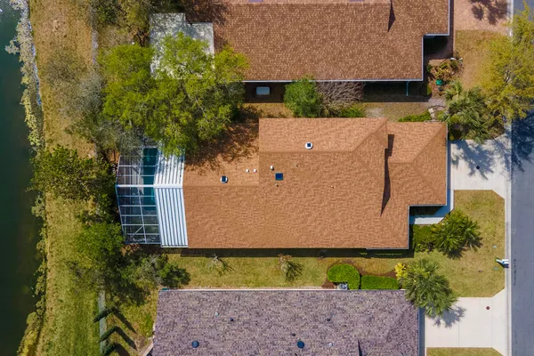 a view of a livingroom with wooden floor and a window