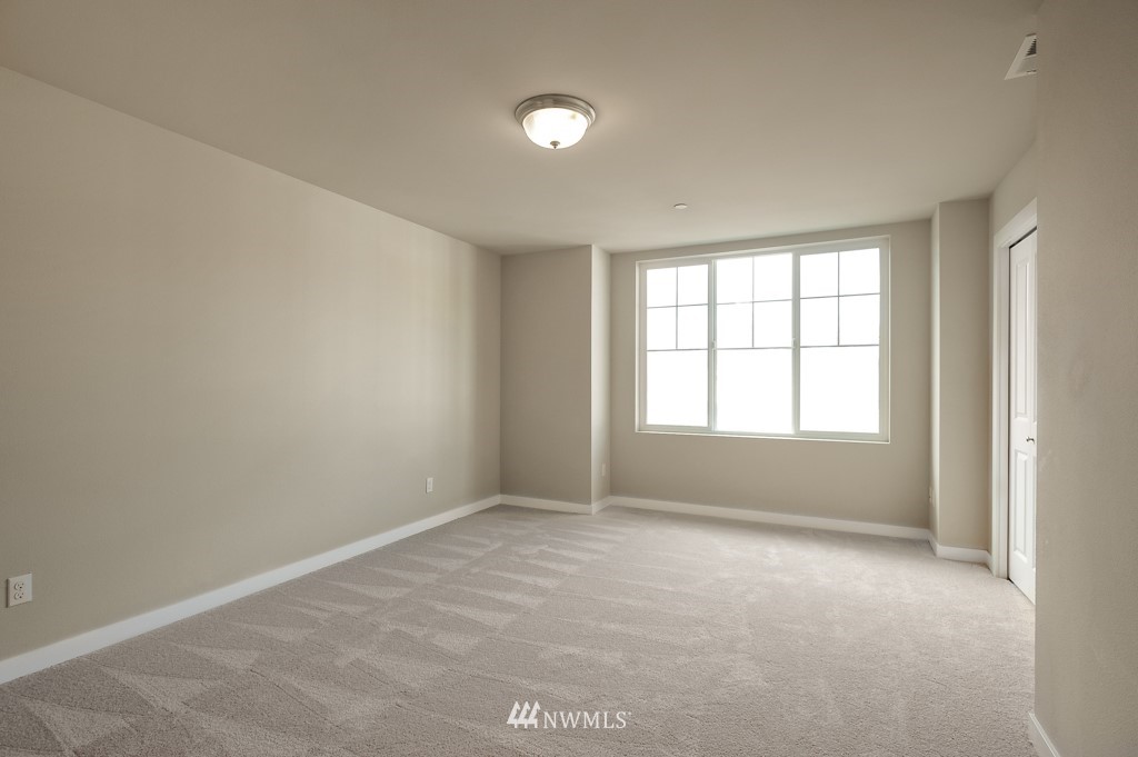 1621 Seattle Hill Road, Unit CC3 Bothell, WA 98012 - Photo 11 of 25 an empty room with windows and closet