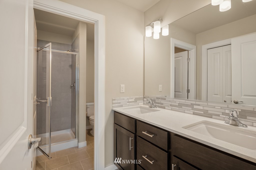 1621 Seattle Hill Road, Unit CC3 Bothell, WA 98012 - Photo 12 of 25 a bathroom with a sink double vanity and a mirror