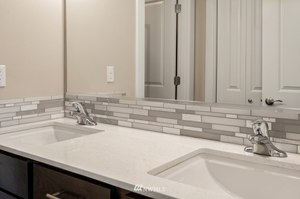 1621 Seattle Hill Road, Unit CC3 Bothell, WA 98012 - Photo 13 of 25 a bathroom with a sink and a mirror