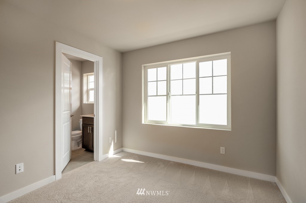 1621 Seattle Hill Road, Unit CC3 Bothell, WA 98012 - Photo 15 of 25 an empty room with windows and closet