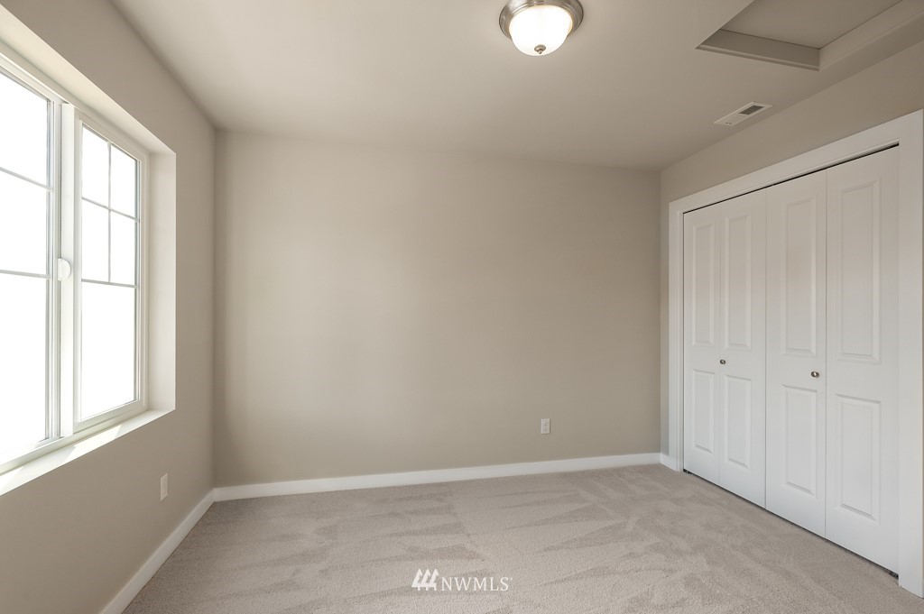 1621 Seattle Hill Road, Unit CC3 Bothell, WA 98012 - Photo 17 of 25 an empty room with windows