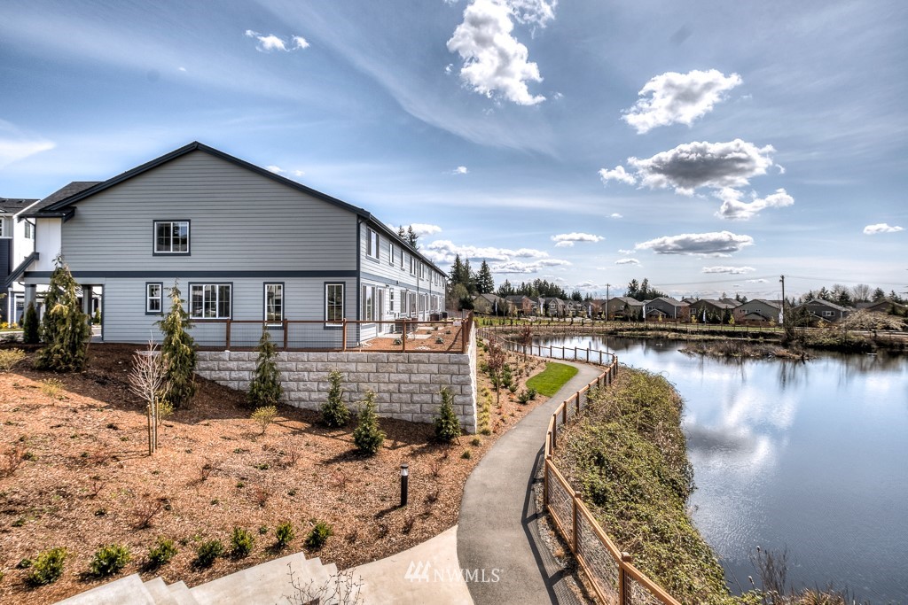 1621 Seattle Hill Road, Unit CC3 Bothell, WA 98012 - Photo 22 of 25 a view of a house with a yard patio and lake view