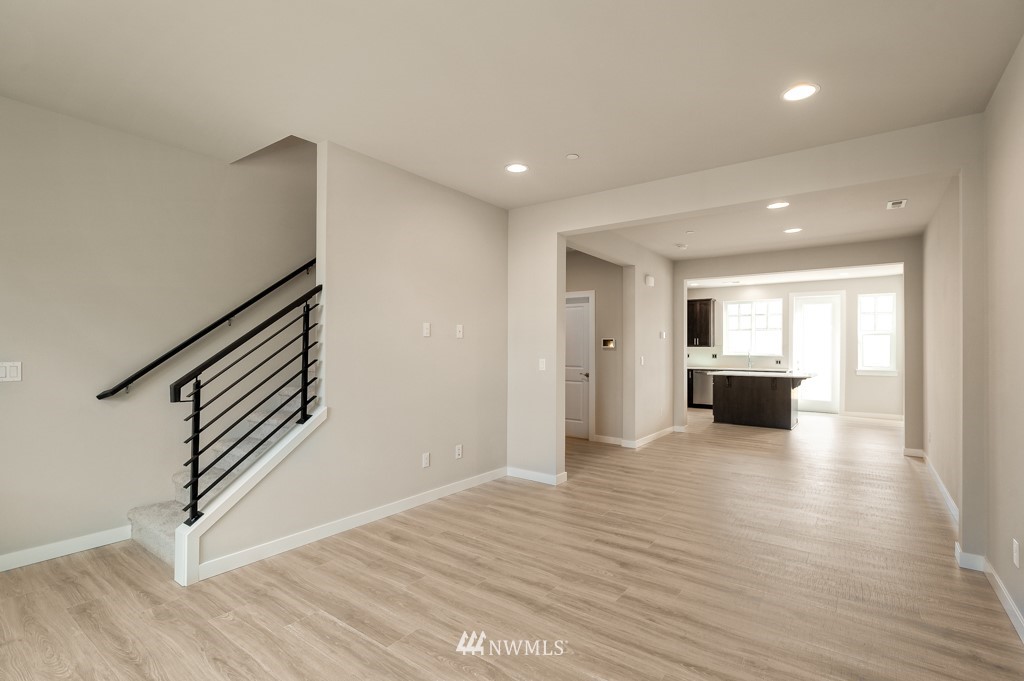1621 Seattle Hill Road, Unit CC3 Bothell, WA 98012 - Photo 7 of 25 a view of a hallway with wooden floor kitchen view and a window