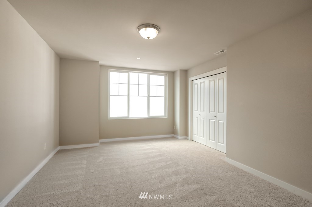 1621 Seattle Hill Road, Unit CC3 Bothell, WA 98012 - Photo 10 of 25 an empty room with windows
