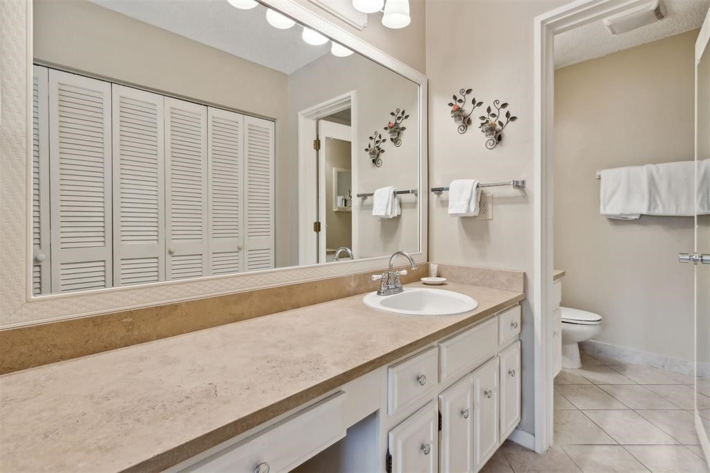 2004 Beachwood Road, Unit 2004 Fernandina Beach, FL 32034 - Photo 30 of 54 a bathroom with a sink and a mirror