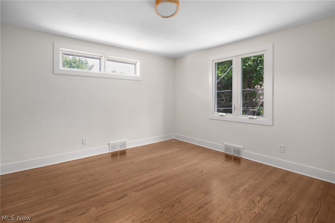 22625 Rye Road Shaker Heights, OH 44122 - Photo 23 of 38 Room featuring wood-finish flooring, crisp white walls, and bright white trim