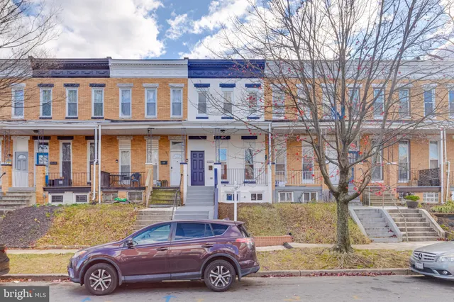 a car parked in front of a building