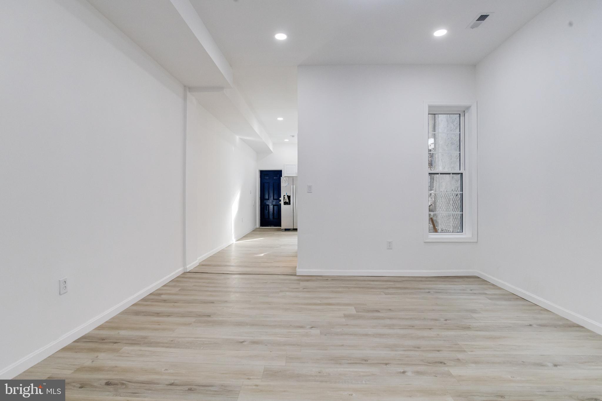 3015 Windsor Avenue Baltimore, MD 21216 - Photo 21 of 84 a view of an empty room with wooden floor