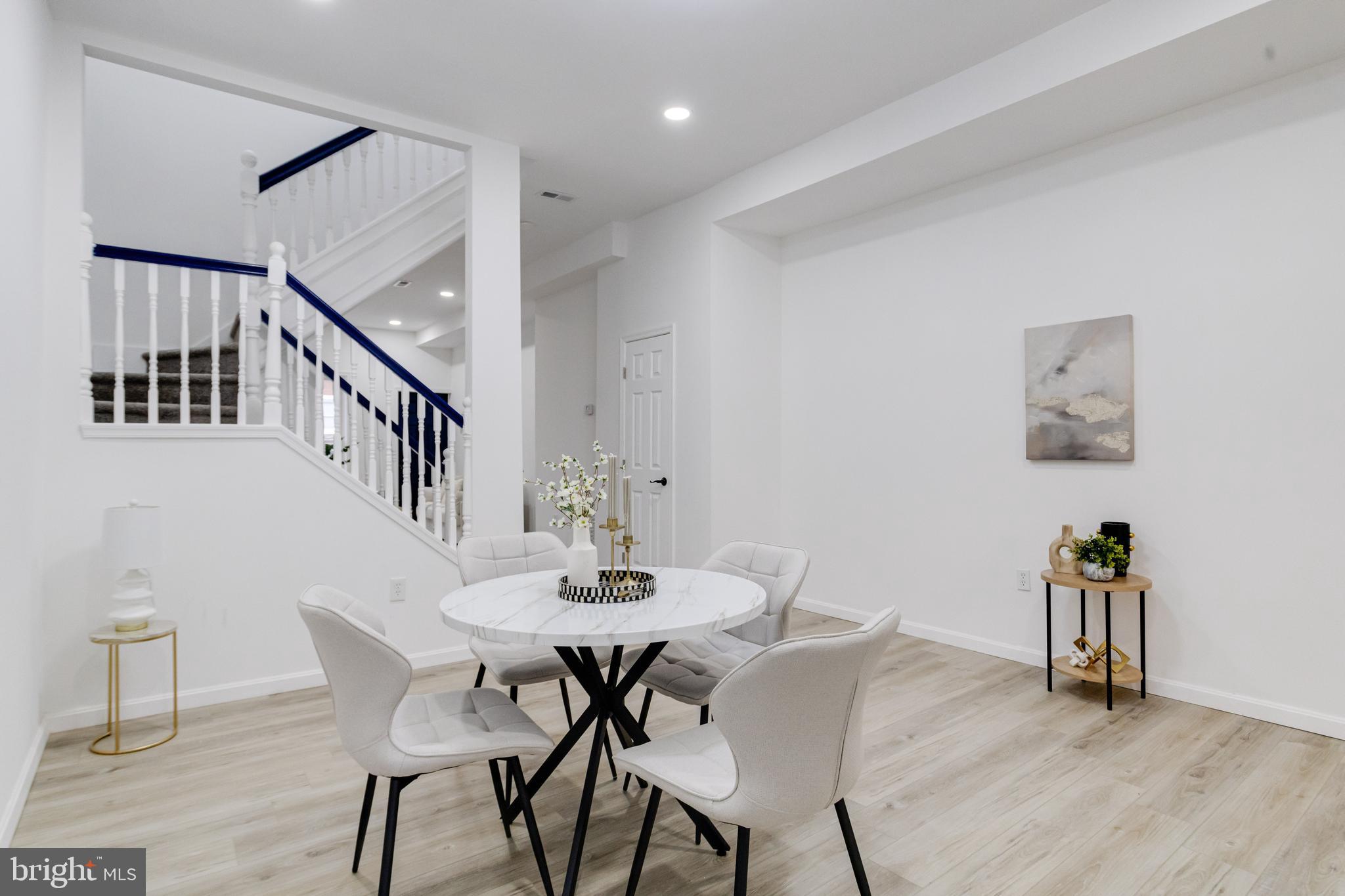 3015 Windsor Avenue Baltimore, MD 21216 - Photo 25 of 84 a view of a dining room with furniture and wooden floor
