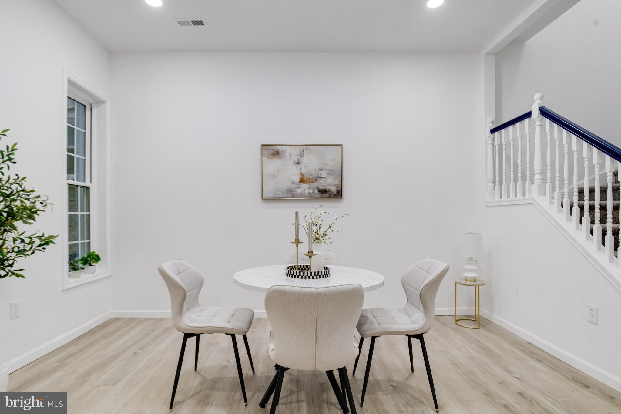 3015 Windsor Avenue Baltimore, MD 21216 - Photo 29 of 84 a view of a dining room with furniture and wooden floor