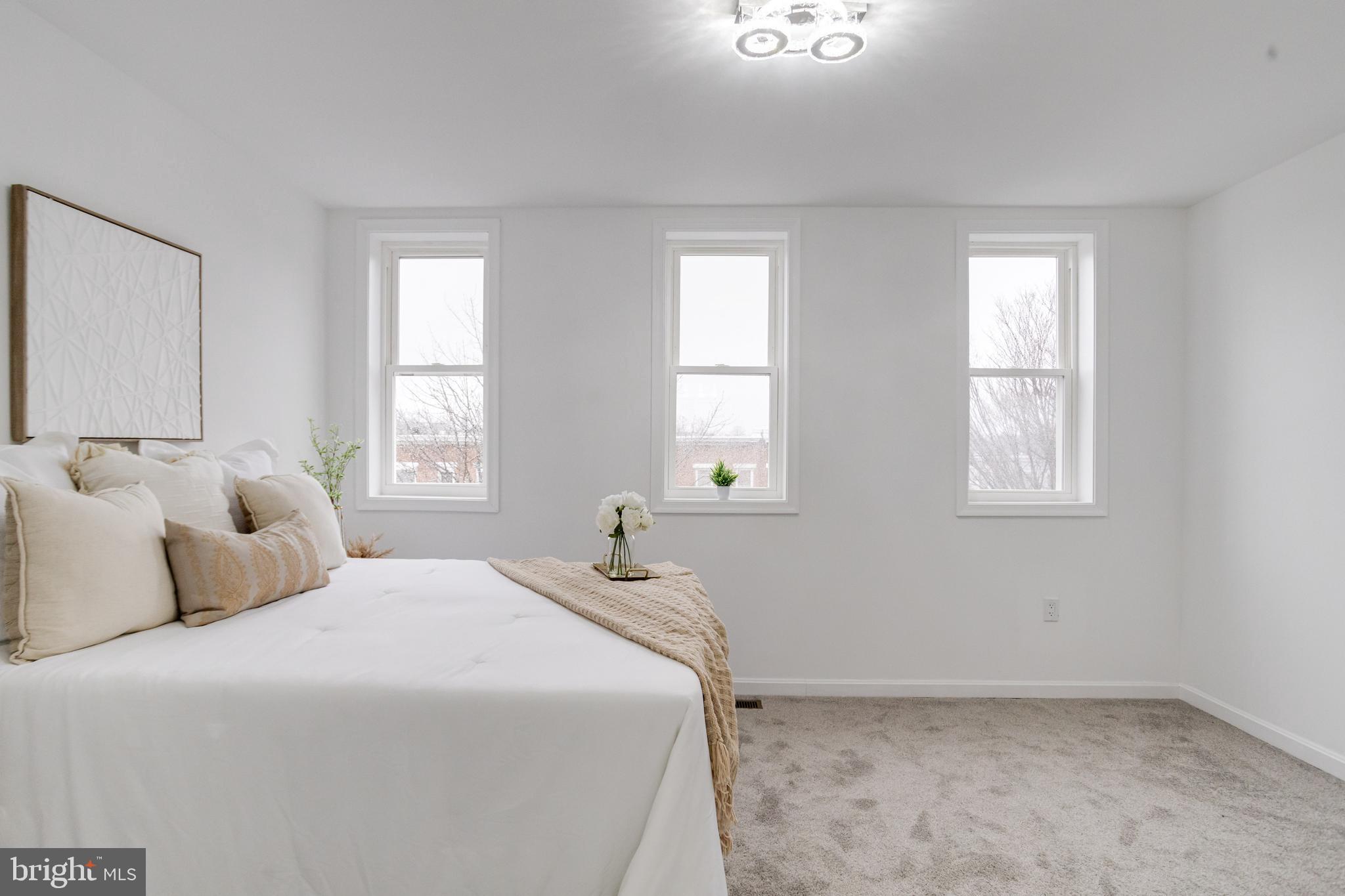 3015 Windsor Avenue Baltimore, MD 21216 - Photo 41 of 84 a bedroom with a bed and a window