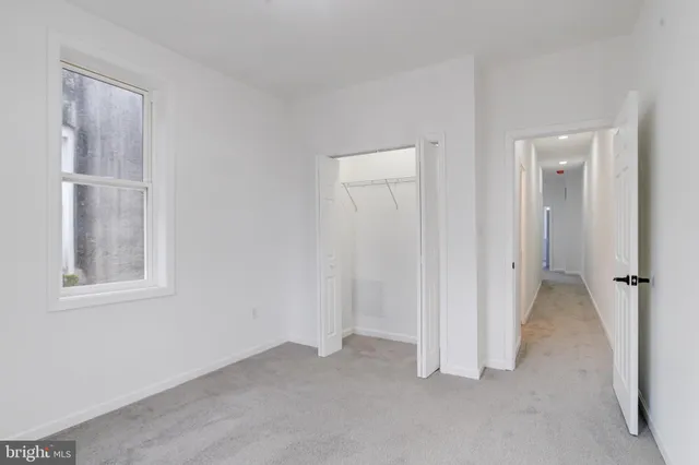a view of a house with wooden fence
