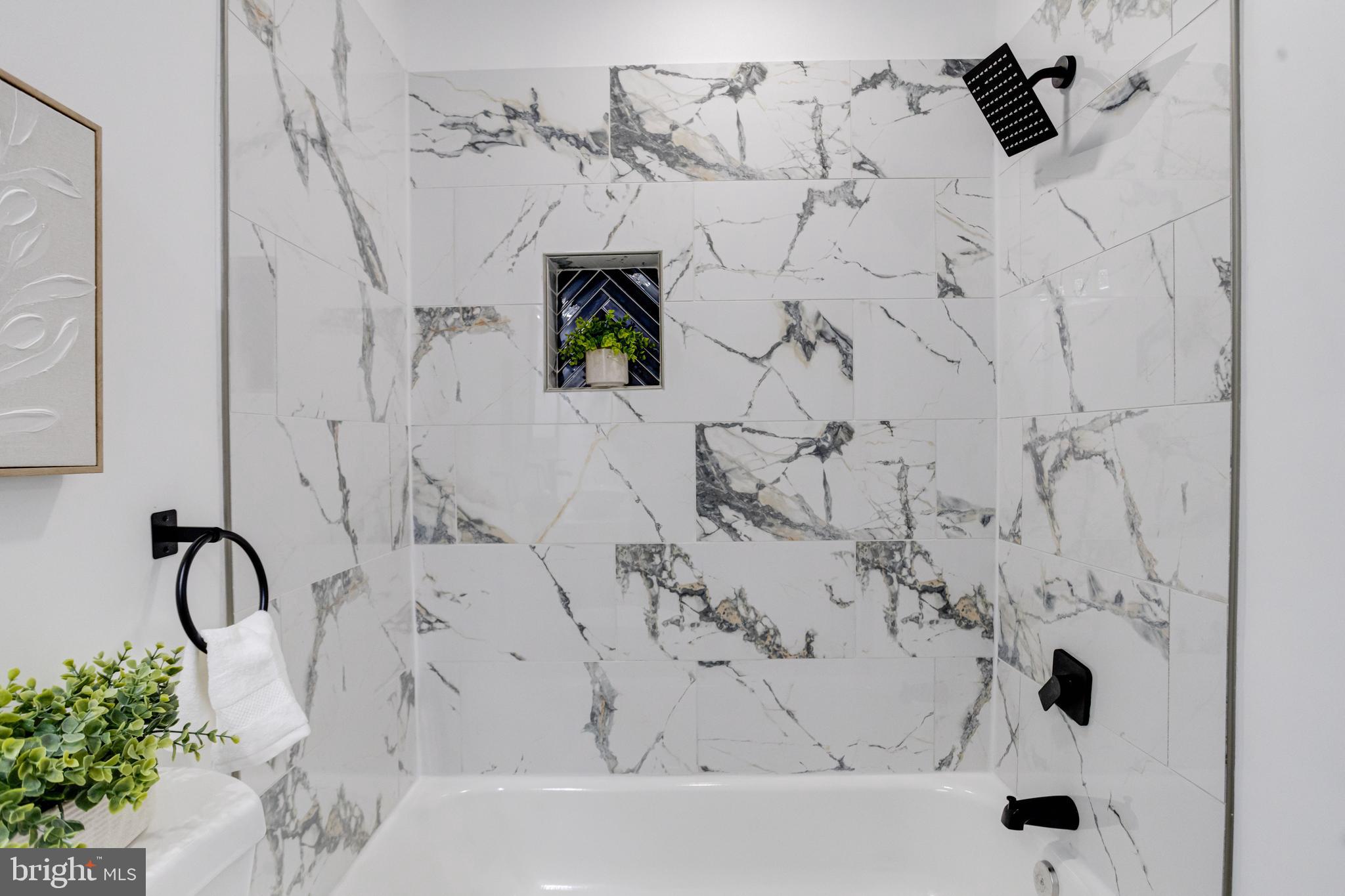 3015 Windsor Avenue Baltimore, MD 21216 - Photo 52 of 84 a bathroom with a bathtub and shower