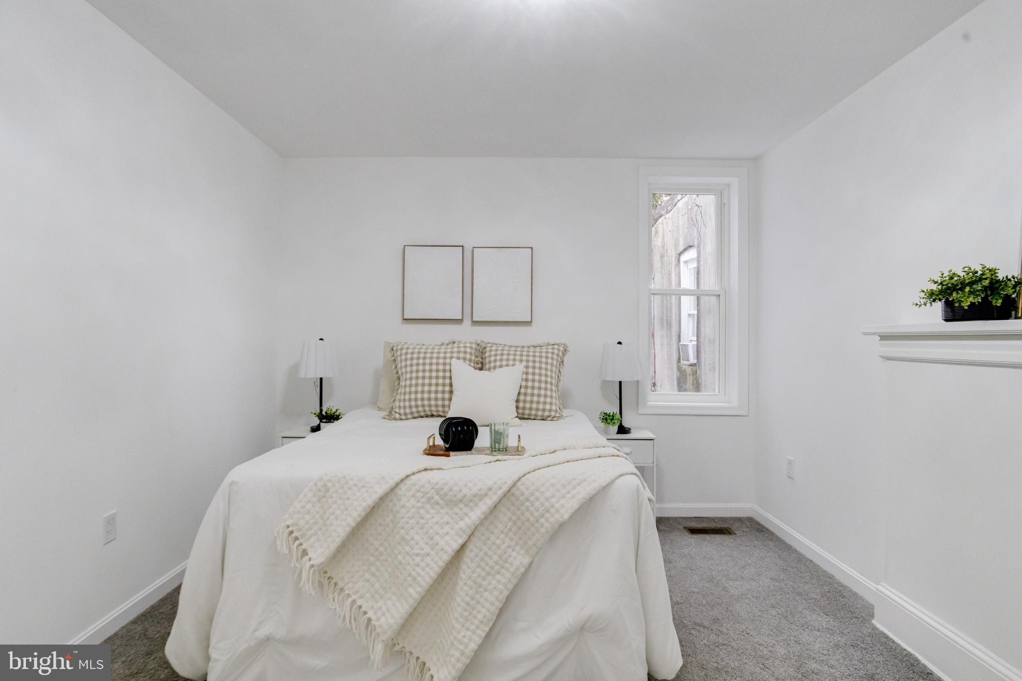 3015 Windsor Avenue Baltimore, MD 21216 - Photo 56 of 84 a bed room with a bed and a window