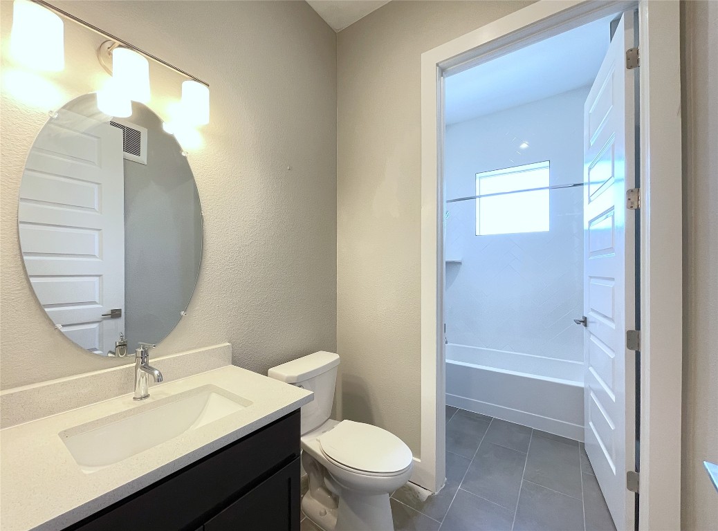4325 Jackson Avenue, Unit 2301 Austin, TX 78731 - Photo 13 of 31 a bathroom with a sink a toilet and shower