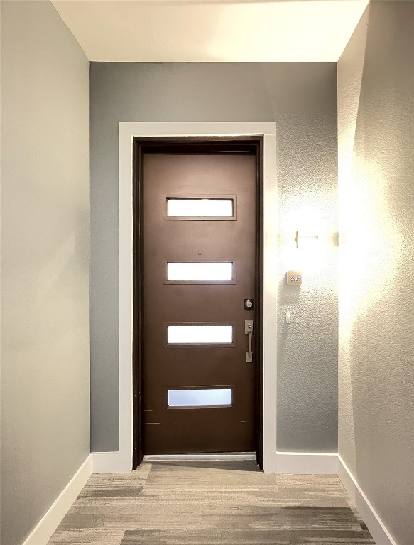 4325 Jackson Avenue, Unit 2301 Austin, TX 78731 - Photo 2 of 31 a view of a hallway with wooden floor