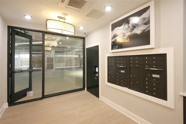a bathroom with a glass door shower and sink