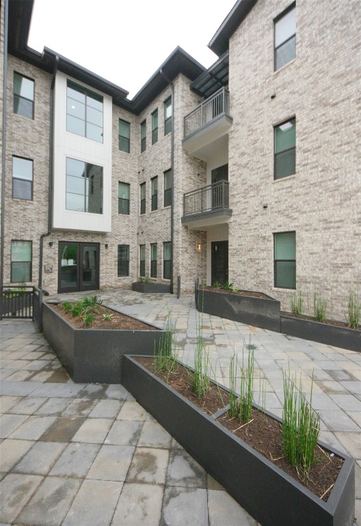4325 Jackson Avenue, Unit 2301 Austin, TX 78731 - Photo 27 of 31 a view of a white building among the ocean