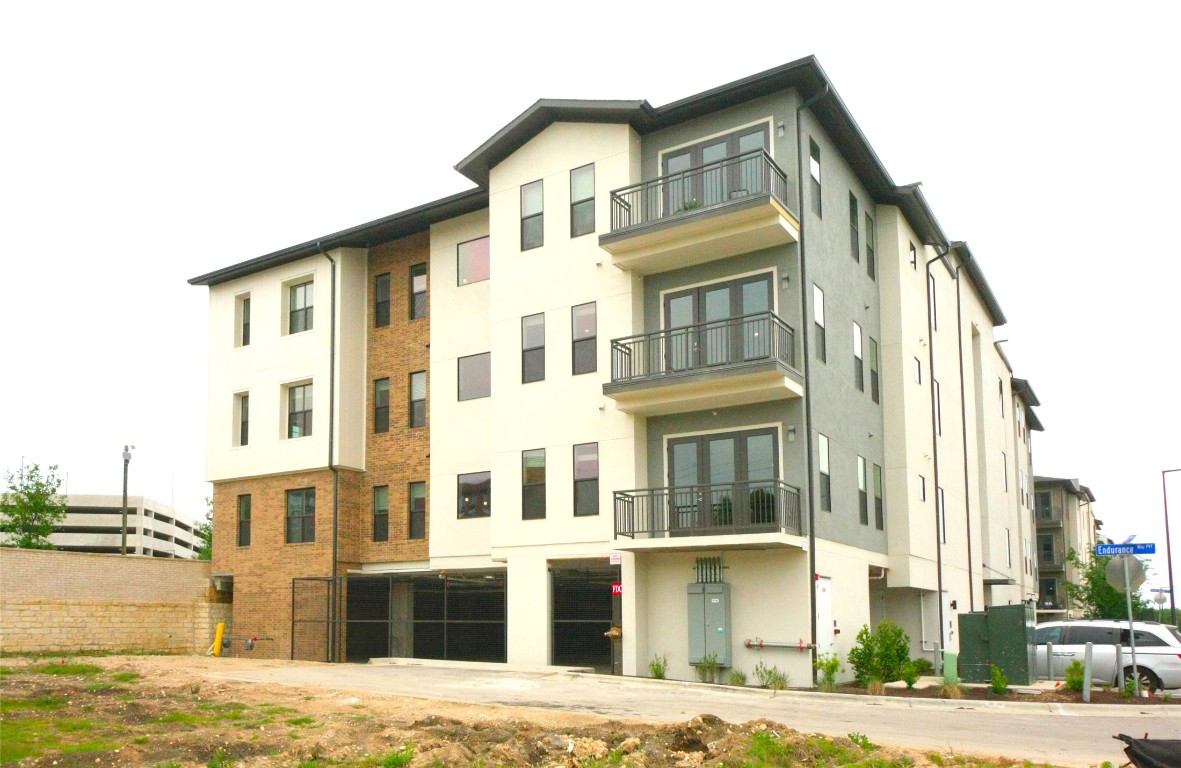 4325 Jackson Avenue, Unit 2301 Austin, TX 78731 - Photo 29 of 31 a front view of a building with a garden