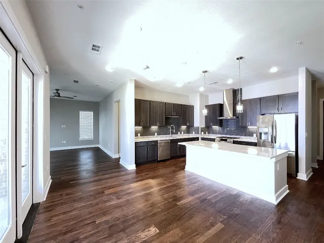 a view of kitchen with sink and microwave