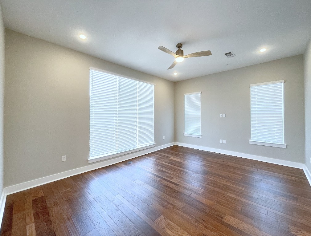 4325 Jackson Avenue, Unit 2301 Austin, TX 78731 - Photo 8 of 31 a view of an empty room with wooden floor and a window