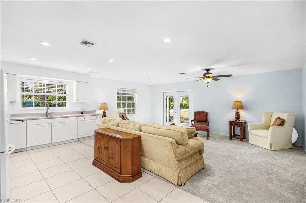 670 27th Street Northwest Naples, FL 34120 - Photo 19 of 39 a living room with furniture and a window