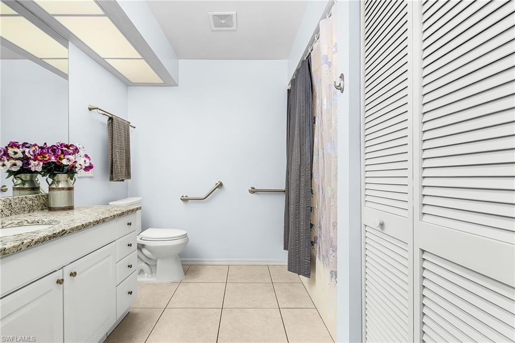 670 27th Street Northwest Naples, FL 34120 - Photo 22 of 39 a bathroom with a granite countertop sink and a mirror