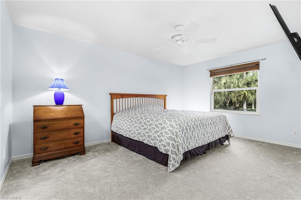 670 27th Street Northwest Naples, FL 34120 - Photo 24 of 39 a bedroom with a bed and a window