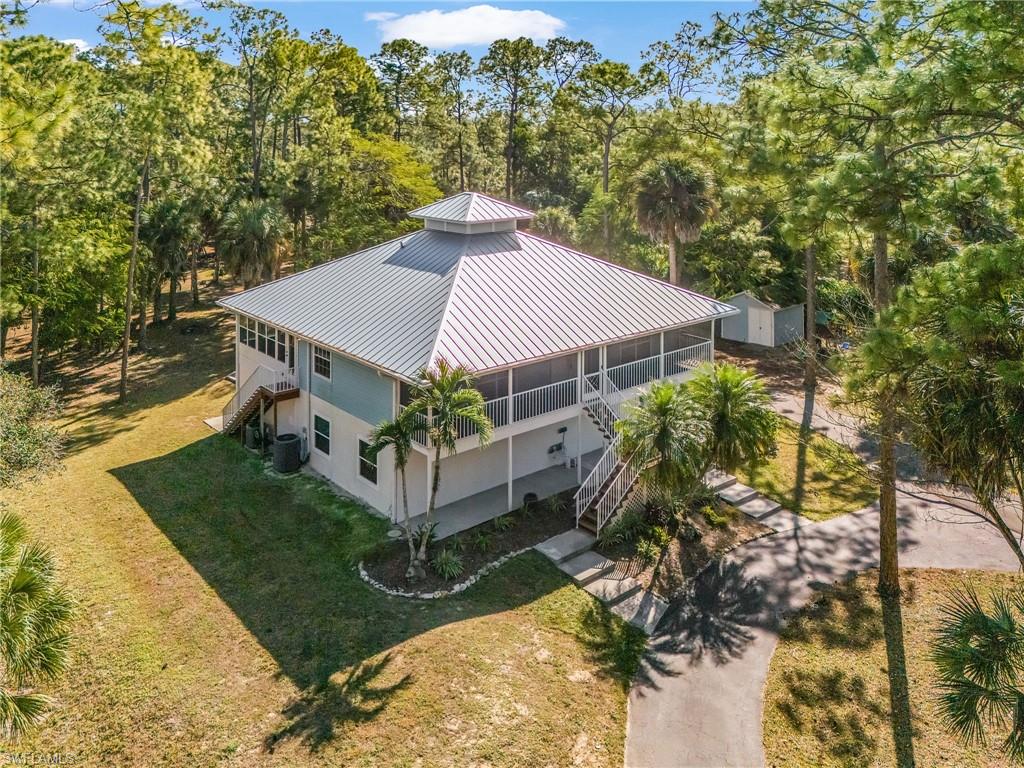670 27th Street Northwest Naples, FL 34120 - Photo 39 of 39 aerial view of a house with a yard
