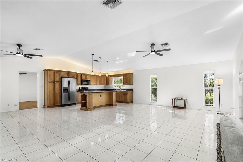 670 27th Street Northwest Naples, FL 34120 - Photo 6 of 39 a view of kitchen with furniture and a ceiling fan