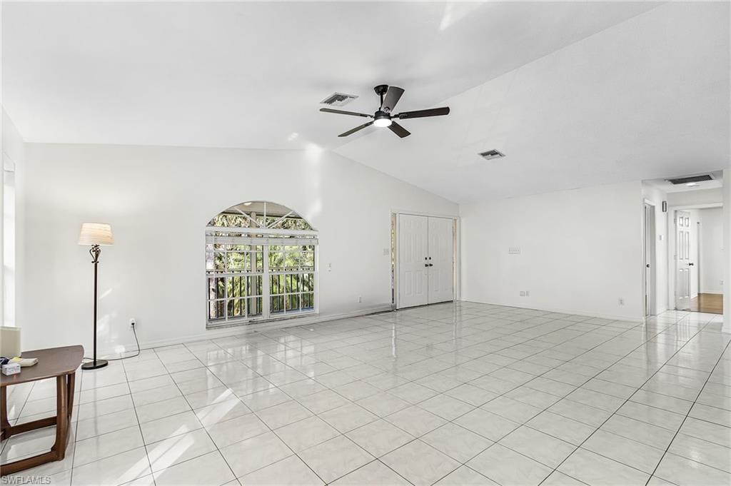670 27th Street Northwest Naples, FL 34120 - Photo 7 of 39 an empty room with windows