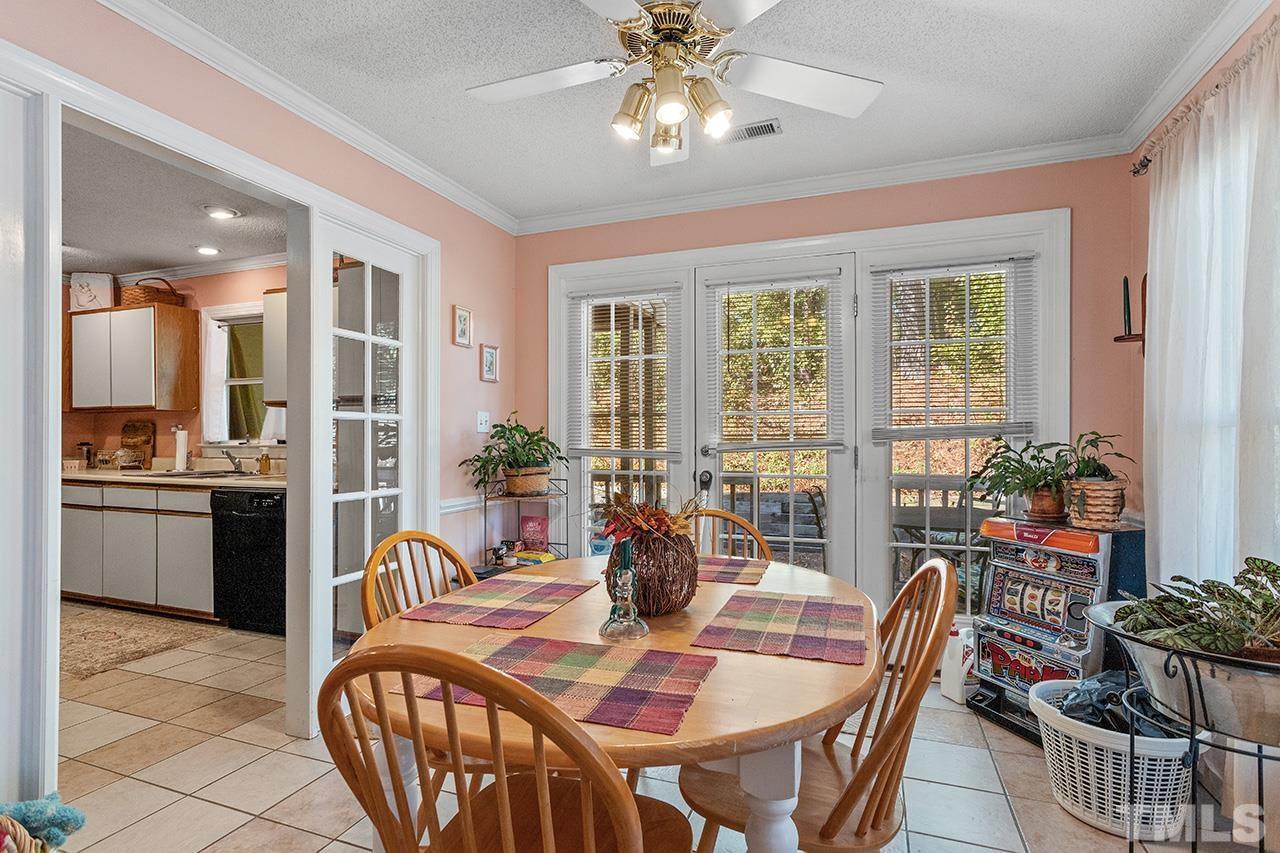 4200 Settlement Drive Durham, NC 27713 - Photo 16 of 32 a view of a dining room with furniture window and outside view