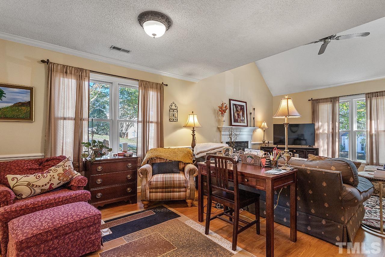 4200 Settlement Drive Durham, NC 27713 - Photo 17 of 32 a living room with furniture and a flat screen tv