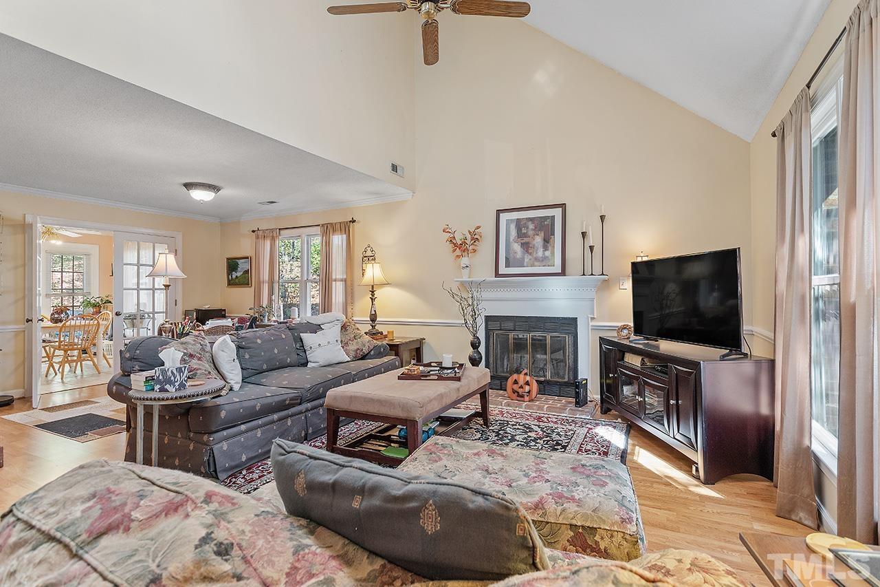 4200 Settlement Drive Durham, NC 27713 - Photo 21 of 32 a living room with fireplace furniture and a flat screen tv