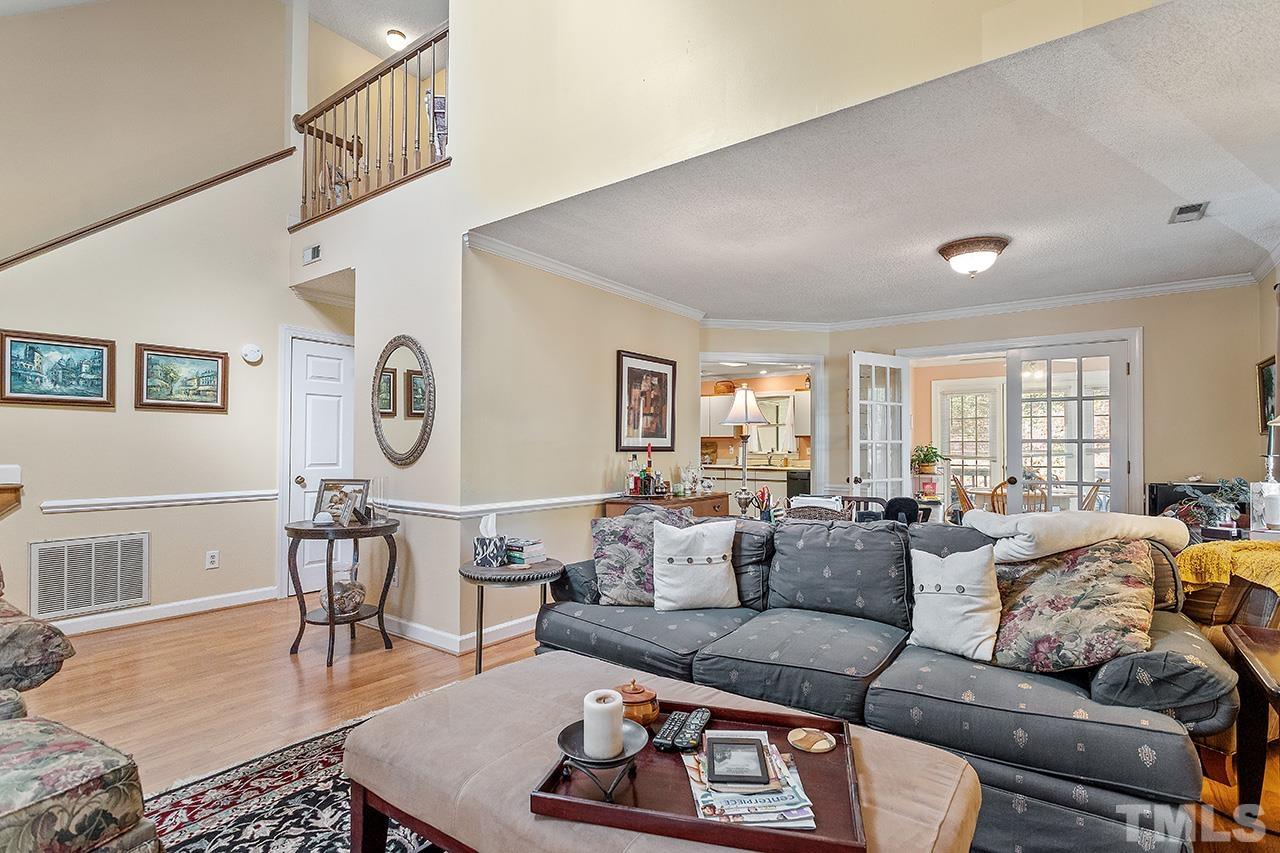 4200 Settlement Drive Durham, NC 27713 - Photo 23 of 32 a living room with furniture a rug and a window