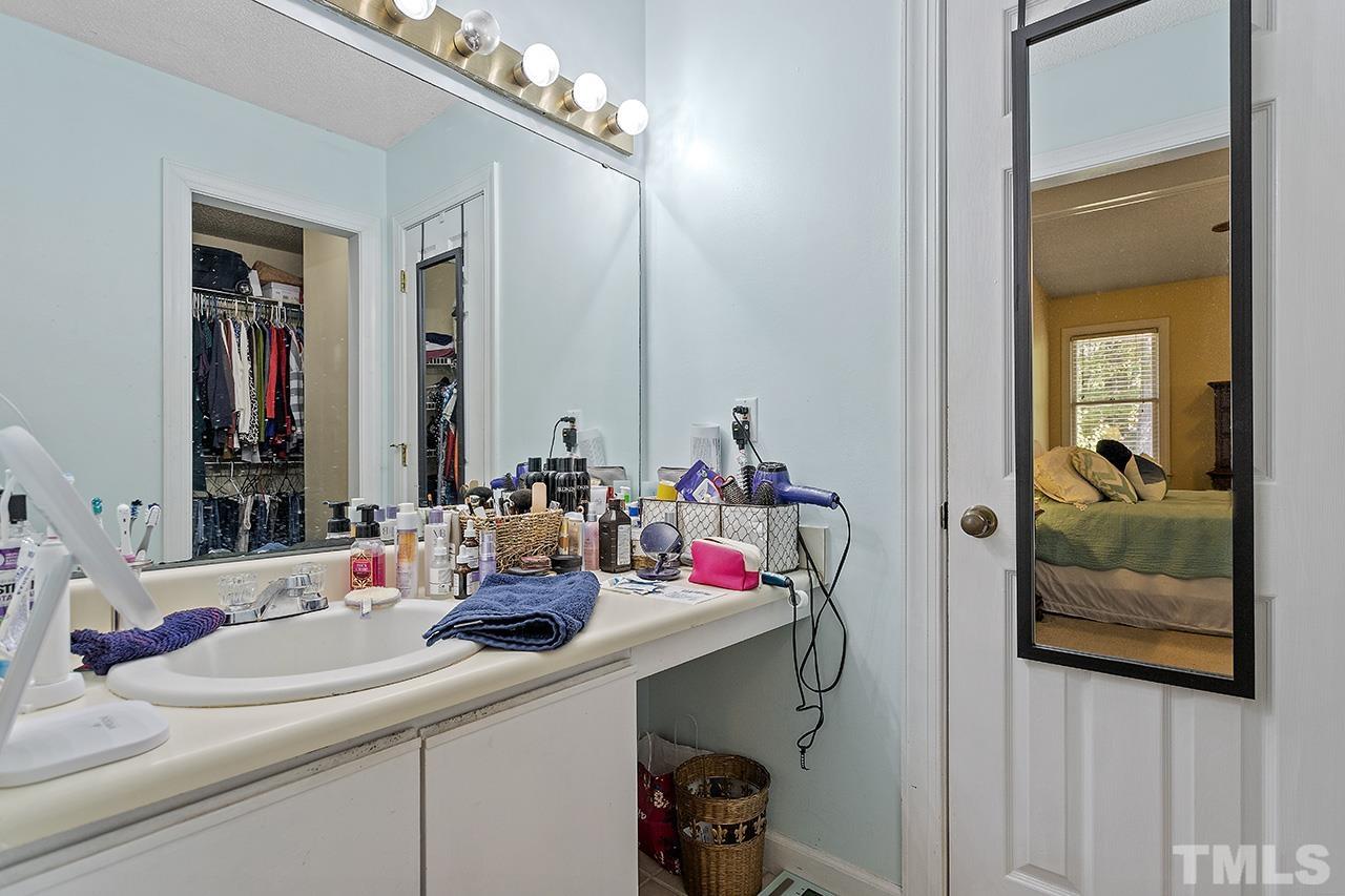 4200 Settlement Drive Durham, NC 27713 - Photo 32 of 32 a bathroom with a sink and a mirror
