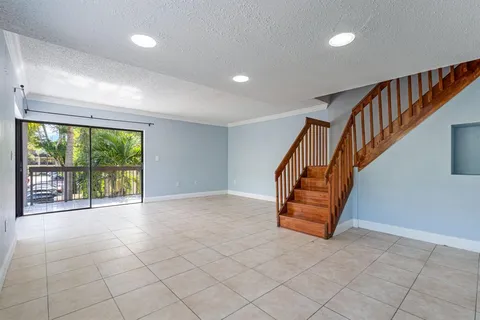 a view of an empty room with windows