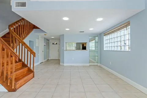 a white toilet sitting next to a shower
