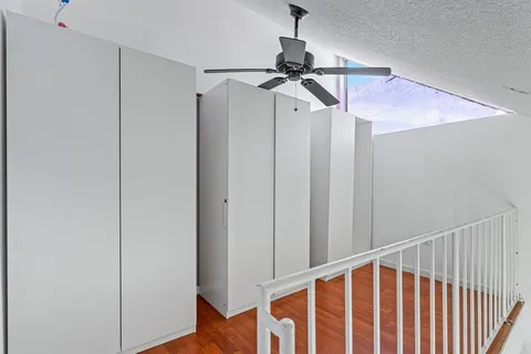 a view of a room with racks on the wall