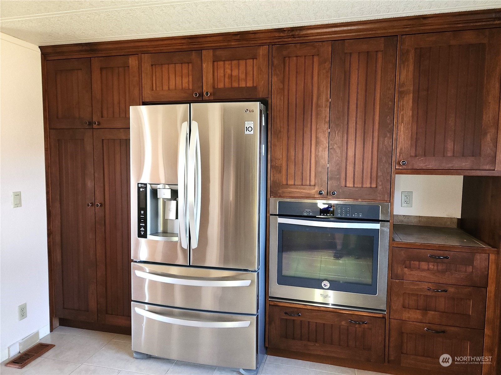 182 Engh Road Omak, WA 98841 - Photo 11 of 40 a kitchen with granite countertop wood cabinets and stainless steel appliances